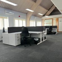 Rayleigh corner desks with desk high pedestals and bespoke desk screens